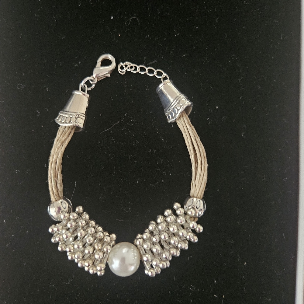 Bracelet with pearl and silver accents. Need help to put on.